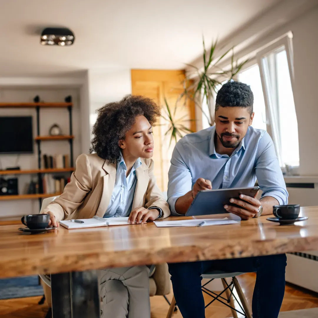 Professionals collaborating over real estate documents