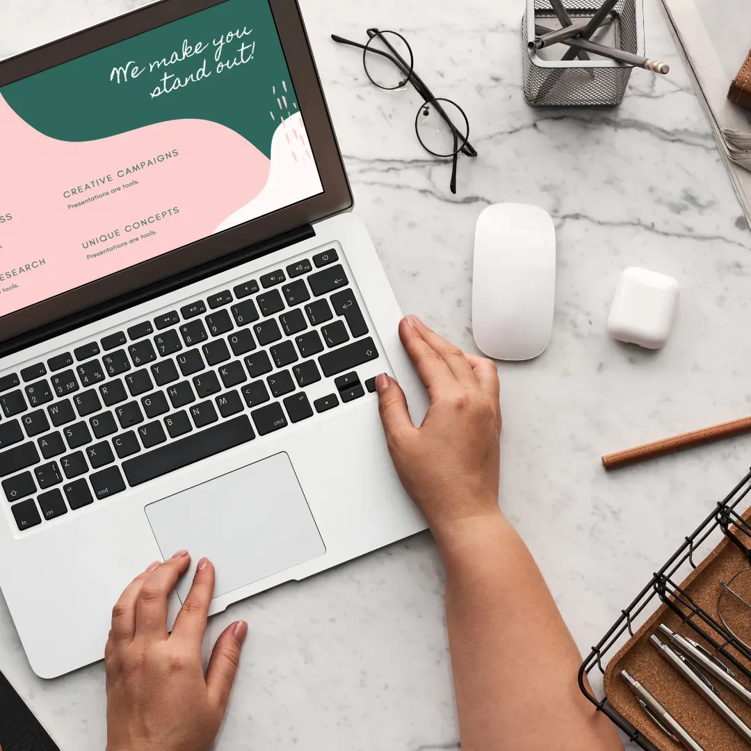 Professional working at a laptop on marketing materials