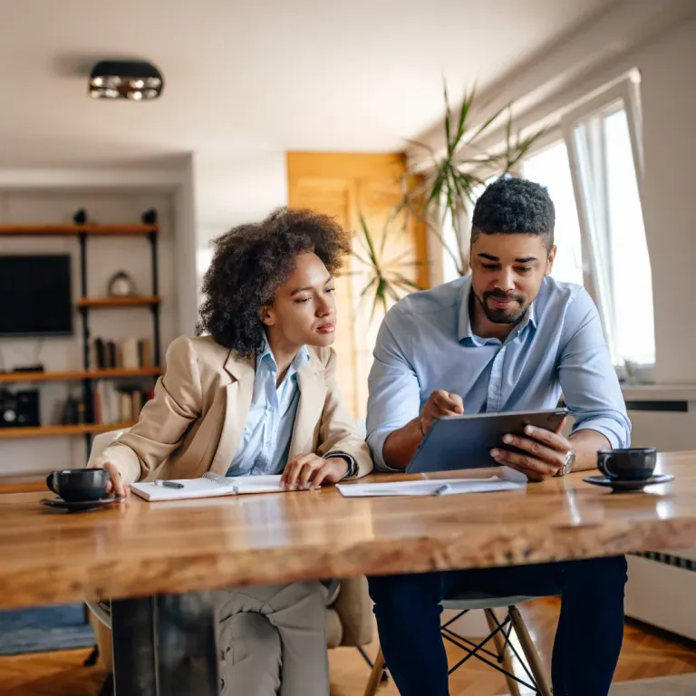 Real estate professionals reviewing documents together